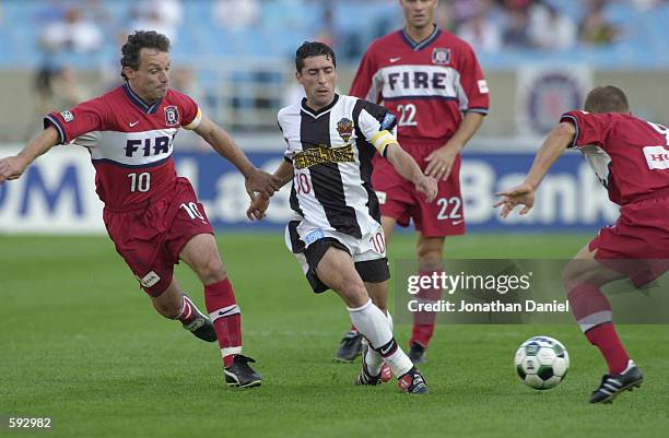 Tab Ramos of the New York / New Jersey MetroStars fights Peter Nowak of the Chicago Fire for possession of the ball during the match at Soldier Field...