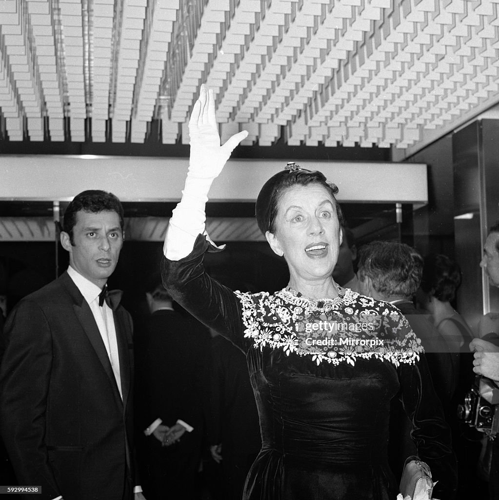 Film Premiere of "Thoroughly Modern Millie". Producer Ross Hunter escorts Mrs Nancy Sinatra.. 12th October 1967.