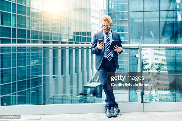 businessman using a mobile phone - business man smartphone tablet stock pictures, royalty-free photos & images