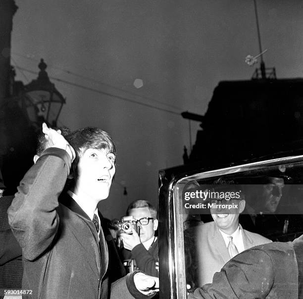 Northern premier of The Beatles film "A Hard Day's Night". George Harrison being photographed as he gets into the car on the way to the premier in...