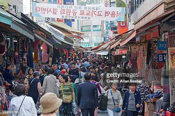 buyers and sellers in namdaemun market - seoul street stock pictures, royalty-free photos & images