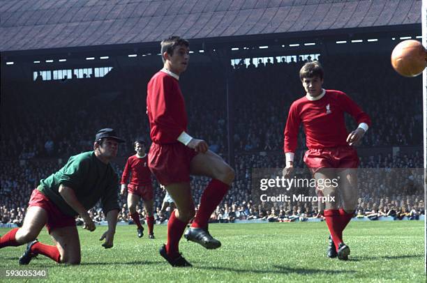 Liverpool 2 v Manchester City 1. Liverpool goalkeeper Tommy Lawrence and defenders Peter Wall and Emlyn Hughes watch a shot from Francis Lee go...