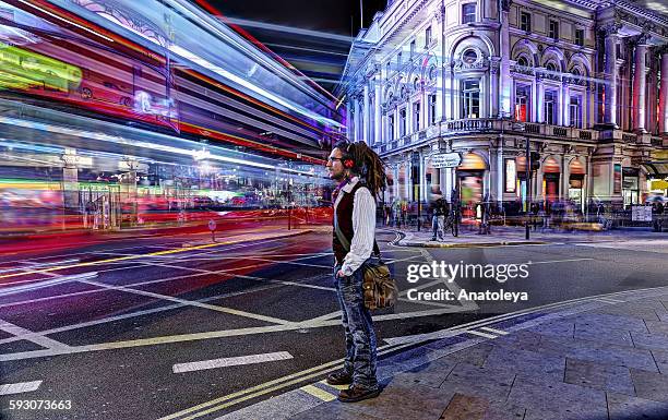 guy in traffic in piccadilly circus - london landmarks stock pictures, royalty-free photos & images