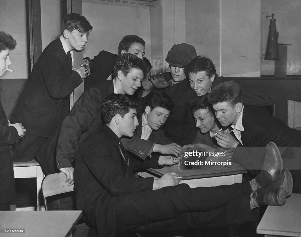 A group of Teddy Boys smoking cigarettes at the Rodney Youth Centre in Liverpool. 19th April 1956
