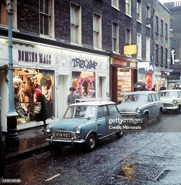 View of Carnaby Street, London. Trendy boutiques including 'Domino Male' and 'Tre Camp'. April 1968.