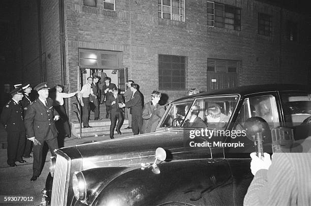 The Beatles Autumn Tour of Great Britain. The band makes a getaway through the stage door to avoid screaming fans waiting for them at the front...