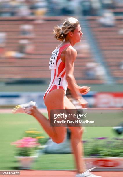 Katrin Krabbe of Germany competes in the 100 meter event of the 1991 IAAF World Championships during August 1991 at the National Olympic Stadium in...
