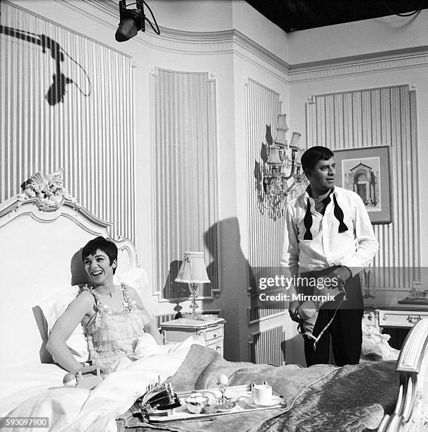 American actor and comedian Jerry Lewis seen here with actress Jacqueline Pearce during a break in filming "Don't Raise the Bridge, Lower the River"...