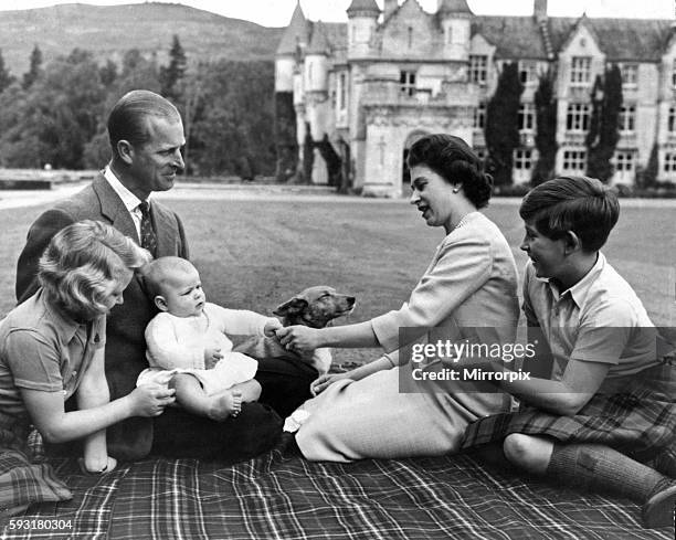 Queen Elizabeth II and her husband Prince Philip, Duke of Edinburgh, with their children Princess Anne, Prince Charles and Prince Andrew on his first...