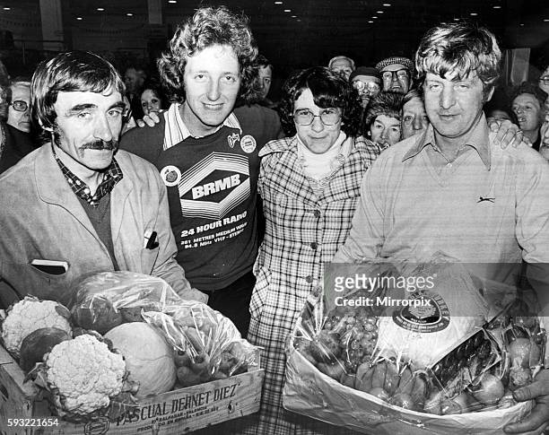 Nicky Steele, BRMB Radio Presenter with Barbara Berry, who was held at knife point and robbed. Pictured receiving gifts from market traders, Frank...