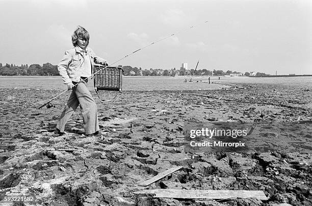 Young boy goes for a spot of fishing at dried out Edgbaston reservoir in Birmingham during the summer heatwave of 1976. 9th August 1976.