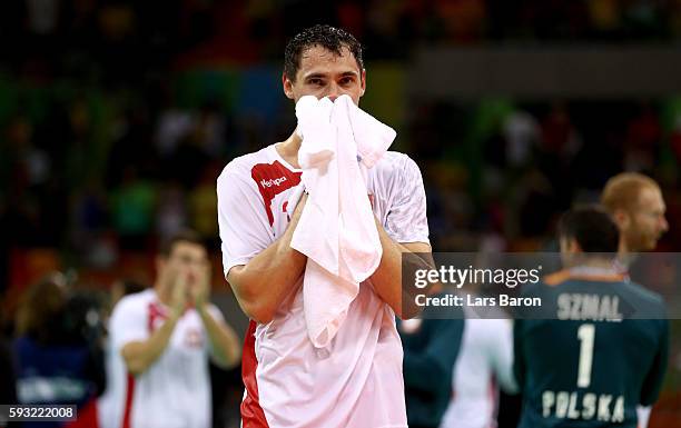 Krzysztof Lijewski of Poland looks dejected after their defeat in the Men's Bronze Medal Match between Poland and Germany on Day 16 of the Rio 2016...