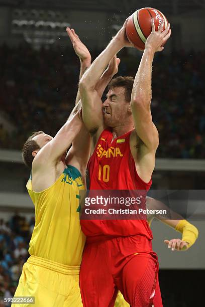 Victor Claver of Spain drives the basket against Joe Ingles of Australia during the Men's Basketball Bronze medal game between Australia and Spain on...