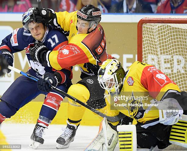 Jamie MacQueen of the Eisbaeren Berlin, Simon Backman of SaiPa Lappeenranta and Jussi Markkanen of SaiPa Lappeenranta during the Champions Hockey...