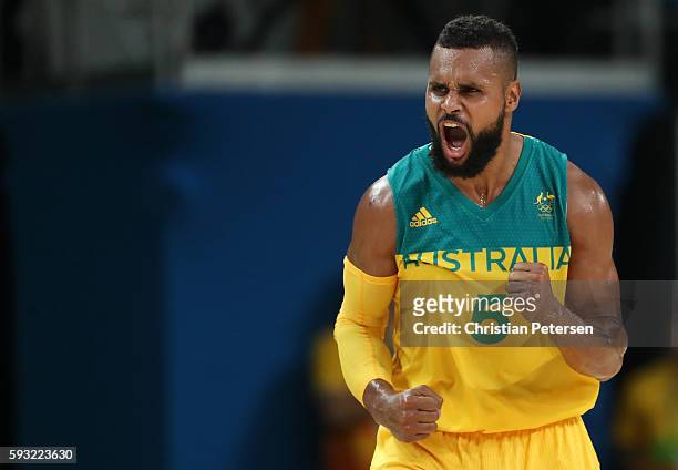 Patty Mills of Australia celebrates a basket during the Men's Basketball Bronze medal game between Australia and Spain on Day 16 of the Rio 2016...