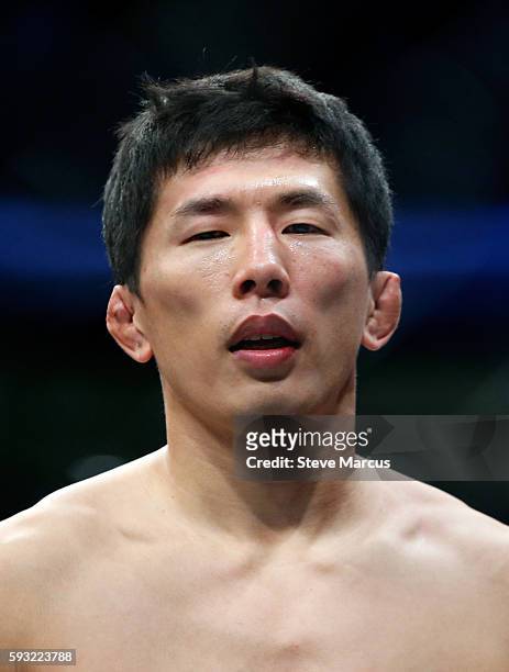 Takeya Mizugaki stands in the Octagon after his first-round TKO loss to Cody Garbrandt in their bantamweight bout at the UFC 202 event at T-Mobile...
