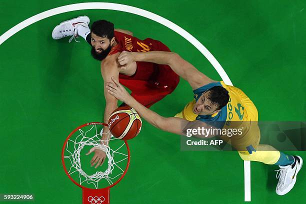 An overview shows Spain's power forward Nikola Mirotic and Australia's centre Andrew Bogut eye a rebound during a Men's Bronze medal basketball match...