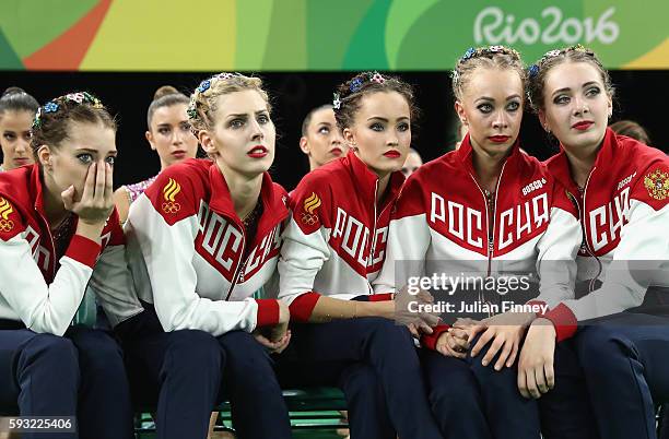 Vera Biriukova, Anastasia Bliznyuk, Anastasiia Maksimova, Anastasiia Tatareva and Maria Tolkacheva of Russia await the scores during the Group...