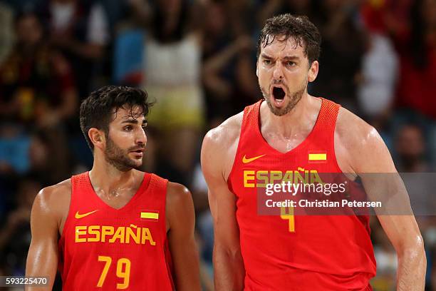 Ricky Rubio of Spain and Pau Gasol of Spain celebrate during the Men's Basketball Bronze medal game between Australia and Spain on Day 16 of the Rio...