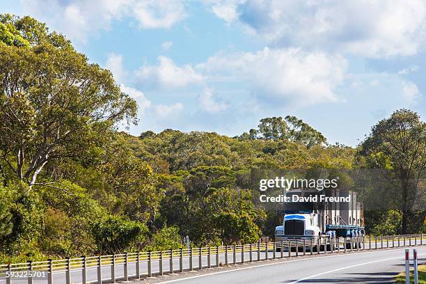 semi trailer truck on australian bush highway - bush land stock pictures, royalty-free photos & images