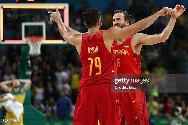 Sergio Rodriguez of Spain and Ricky Rubio of Spain celebrate winning the Men's Basketball Bronze medal game between Australia and Spain on Day 16 of...