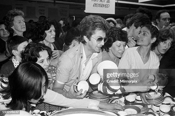 Shoppers in the china department at Harrods during the sale. 15th July 1979.