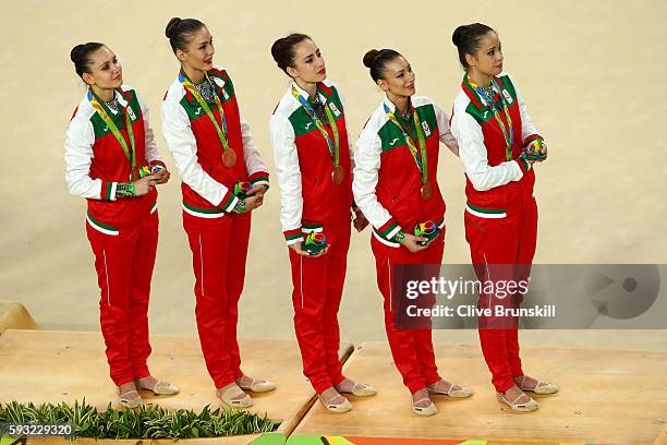 Bronze medalists Reneta Kamberova, Lyubomira Kazanova, Mihaela Maevska, Tsvetelina Naydenova and Hristiana Todorova of Bulgaria stand on the podium...