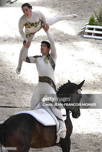 Equestrian vaulting champion, French Lucie and Vincent Chevrel compete on their horse Rayo de la Luz, during the "Pas de deux" event of the FEI World...