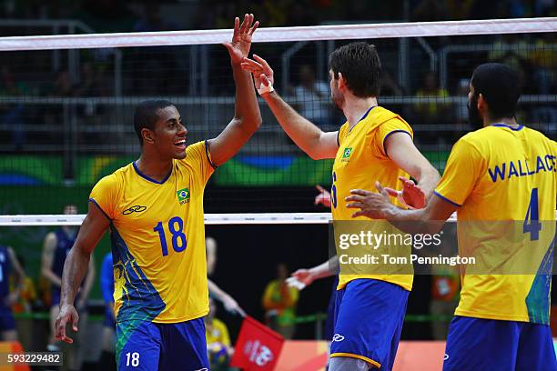 Ricardo Lucarelli of Brazil and Lucas Saatkamp of Brazil react during the Men's Gold Medal Match between Italy and Brazil on Day 16 of the Rio 2016...