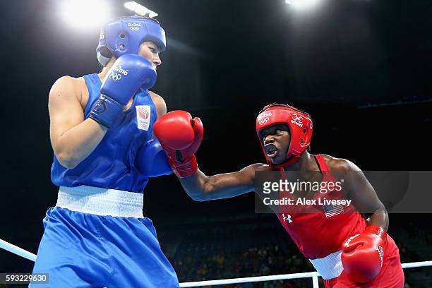 Claressa Maria Shields of the United States and Nouchka Fontijn of the Netherlands compete during the Women's Middle Final Bout on Day 16 of the Rio...