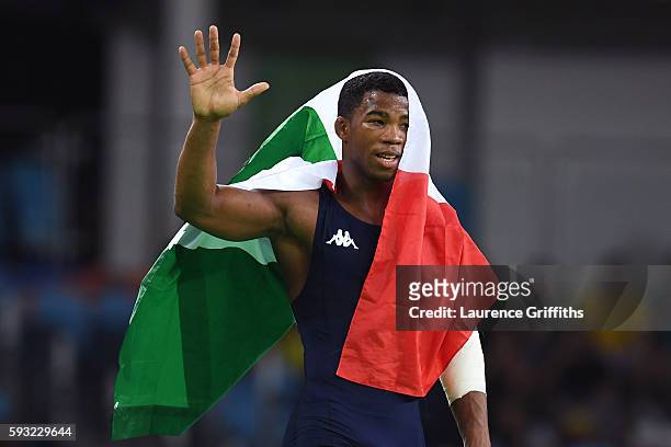 Frank Chamizo Marquez of Italy celebrates after winning bronze in the Men's Freestyle 65kg Bronze match against Frank Molinaro of the United States...