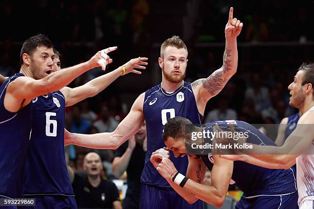 Ivan Zaytsev of Italy celebrates with his team during the Men's Gold Medal Match between Italy and Brazil on Day 16 of the Rio 2016 Olympic Games at...