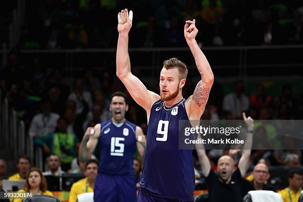 Ivan Zaytsev of Italy celebrates with his team during the Men's Gold Medal Match between Italy and Brazil on Day 16 of the Rio 2016 Olympic Games at...