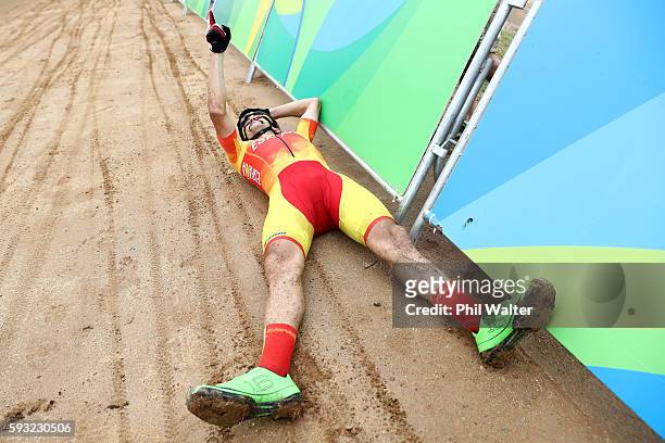Carlos Coloma Nicolas of Spain, bronze, celebrates after the Men's Cross-Country on Day 16 of the Rio 2016 Olympic Games at Mountain Bike Centre on...