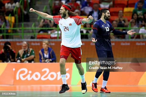 Mikkel Hansen of Denmark reacts during the first half against France in the Men's Gold Medal Match between Denmark and France on Day 16 of the Rio...