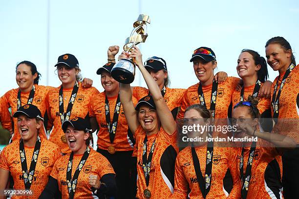 Charlotte Edwards, captain of Southern Vipers lifts the trophy with the team after victory in their final match against Western Storm during the Kia...