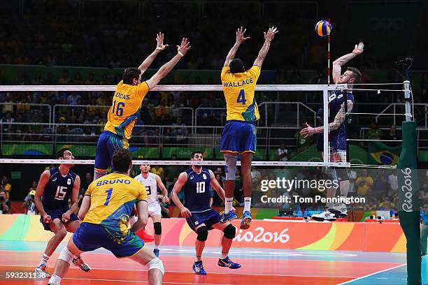 Ivan Zaytsev of Italy spikes the ball during the Men's Gold Medal Match between Italy and Brazil on Day 16 of the Rio 2016 Olympic Games at...