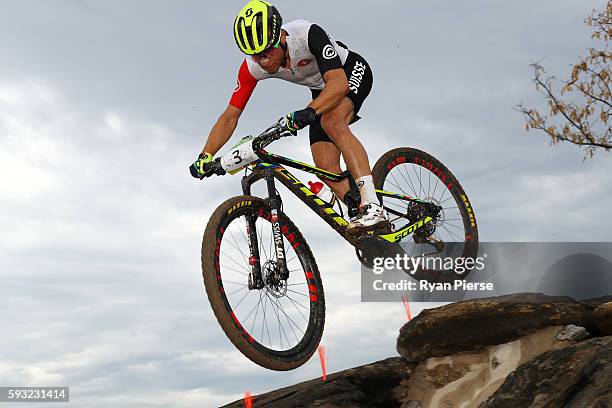 Nino Schurter of Switzerland competes during the Men's Cross-Country on Day 16 of the Rio 2016 Olympic Games at Mountain Bike Centre on August 21,...