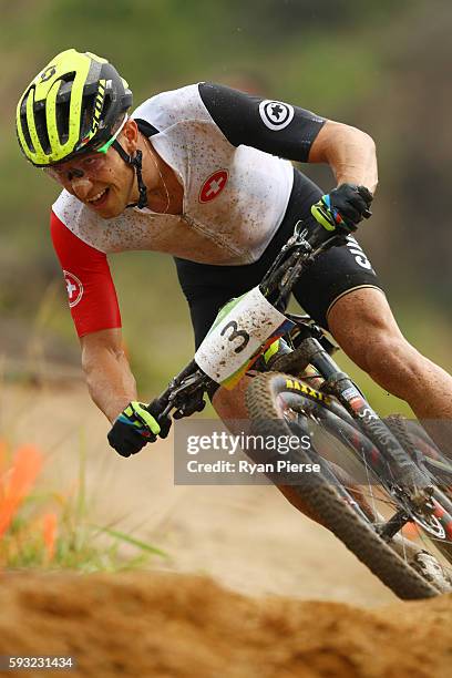 Nino Schurter of Switzerland competes during the Men's Cross-Country on Day 16 of the Rio 2016 Olympic Games at Mountain Bike Centre on August 21,...