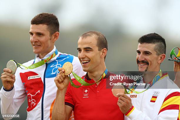 Silver medalist, Jaroslav Kulhavy of Czech Republic, Gold medalist, Nino Schurter of Switzerland, and bronze medalist, Carlos Coloma Nicolas of...