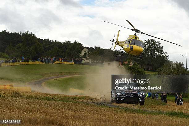 Andreas Mikkelsen of Norway and Anders Jaeger of Norway compete in their Volkswagen Motorport II Volkswagen Polo R WRC during Day Three of the WRC...