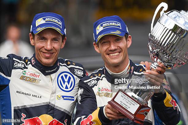 Sebastien Ogier of France and Julien Ingrassia of France celebrate their victory during Day Three of the WRC Germany on August 21, 2016 in Trier,...