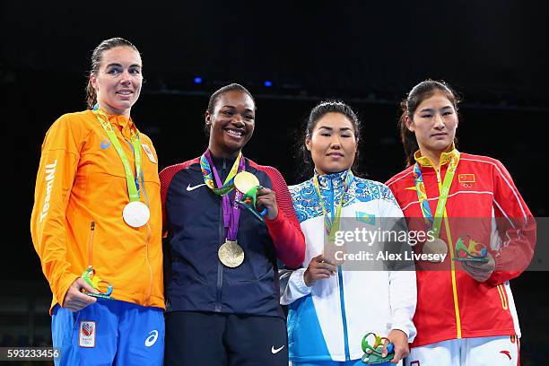 Silver medalist Nouchka Fontijn of the Netherlands, gold medalist Claressa Maria Shields of the United States and bronze medalists Dariga Shakimova...