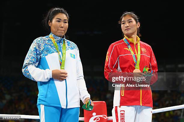 Bronze medalists Dariga Shakimova of Kazakhstan and Qian Li of China pose on the podium during the medal ceremony for the Women's Boxing Middle on...