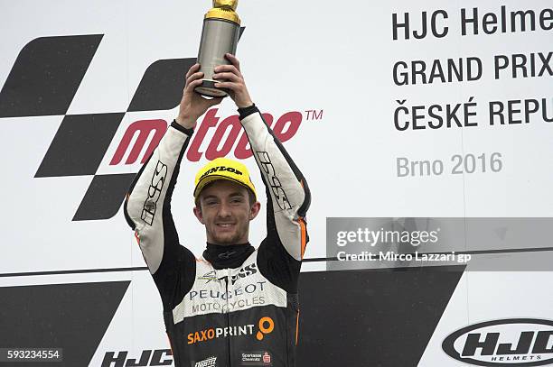 John McPhee of Great Britain and Peugeot Saxoprint MC celebrates the victory on the podium at the end of the Moto3 race during the MotoGp of Czech...