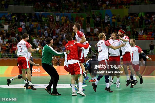 Denmark celebrates defeating France 28-26 to win the gold medal in Men's Handball on Day 16 of the Rio 2016 Olympic Games at Future Arena on August...