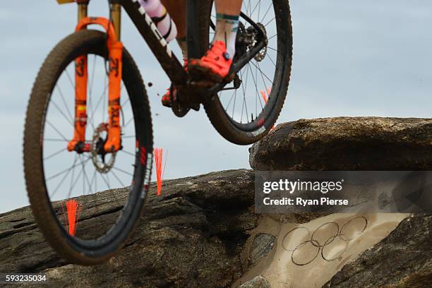 Athletes ride during the Men's Cross-Country on Day 16 of the Rio 2016 Olympic Games at Mountain Bike Centre on August 21, 2016 in Rio de Janeiro,...