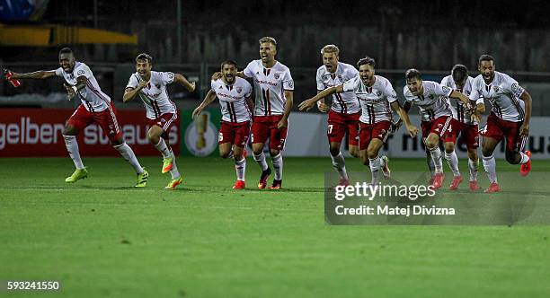 Players of Ingolstadt celebrates after decisive penalty of their team mate Tobias Levels during the DFB Cup match between Erzgebirge Aue and FC...