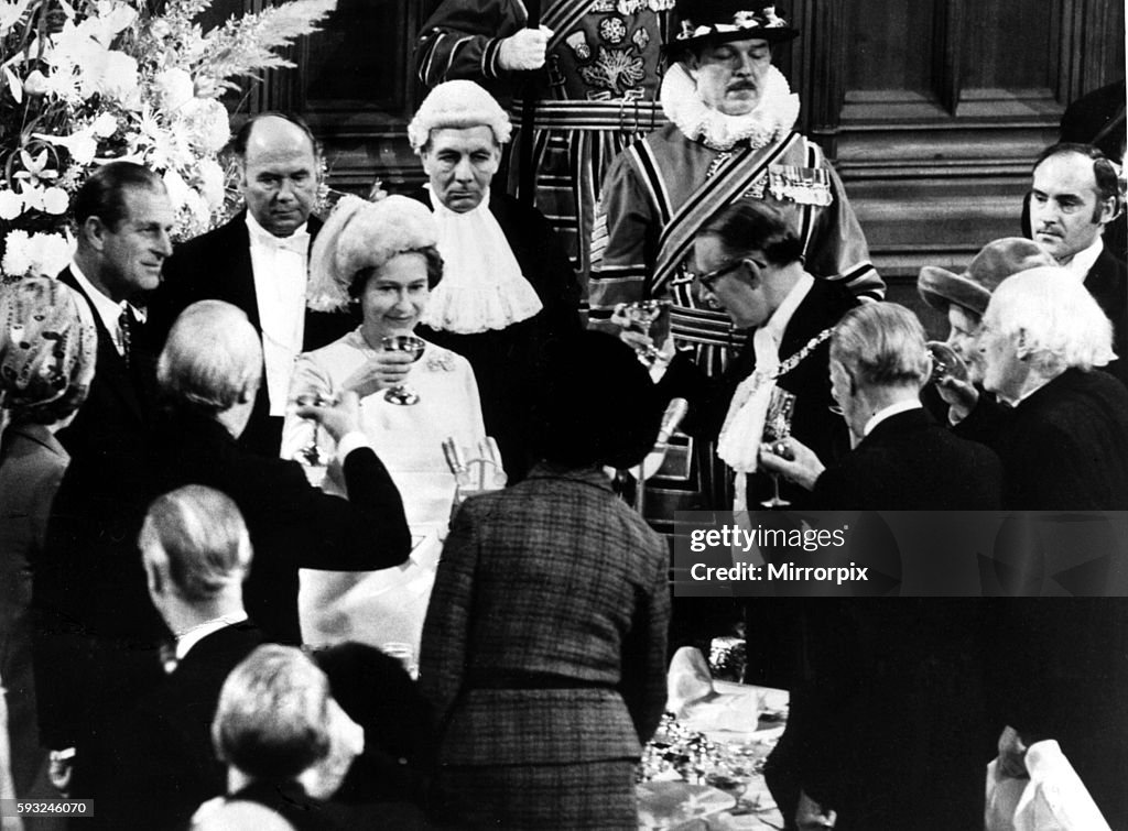 Queen Elizabeth II and Prince Philip celebrate their silver wedding anniversary by being toasted at the Guildhall in Lon