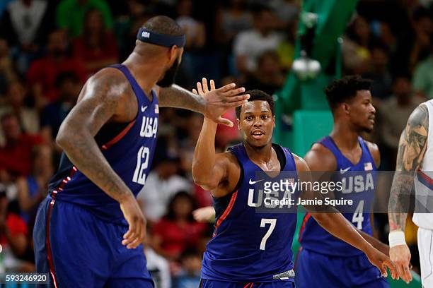 DeMarcus Cousins and Kyle Lowry of United States celebrate after defeating Serbia during the Men's Gold medal game on Day 16 of the Rio 2016 Olympic...